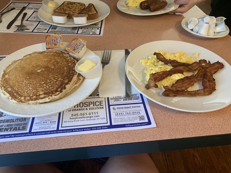 Classic breakfast plates on a casual diner table.
