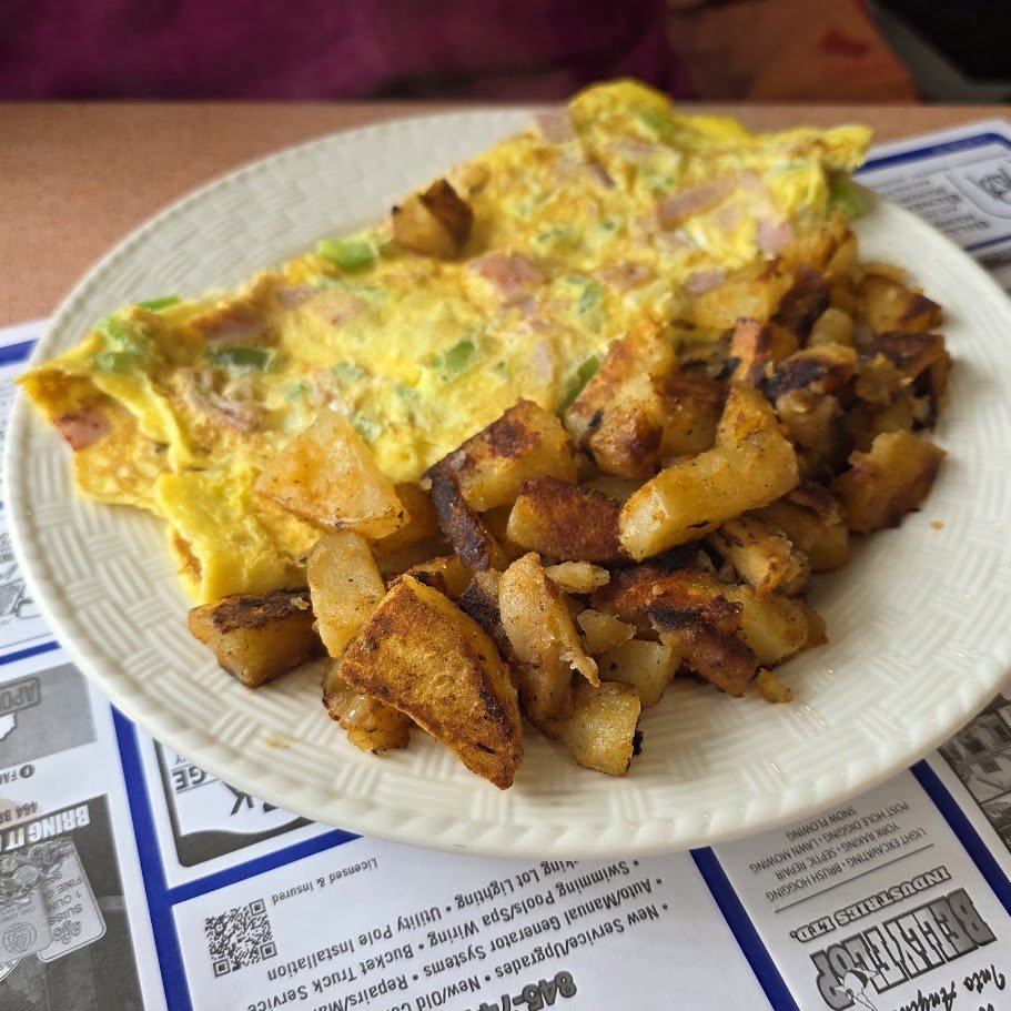Classic breakfast plates on a casual diner table.